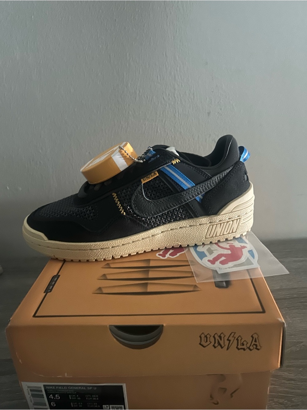 Nike Black & Blue Low-Top Sneakers with Cream Midsole and Gold Accent
